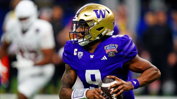 Washington Huskies quarterback Michael Penix Jr. (9) runs the ball during the fourth quarter against the Texas Longhorns in the 2024 Sugar Bowl college football playoff semifinal game at Caesars Superdome.